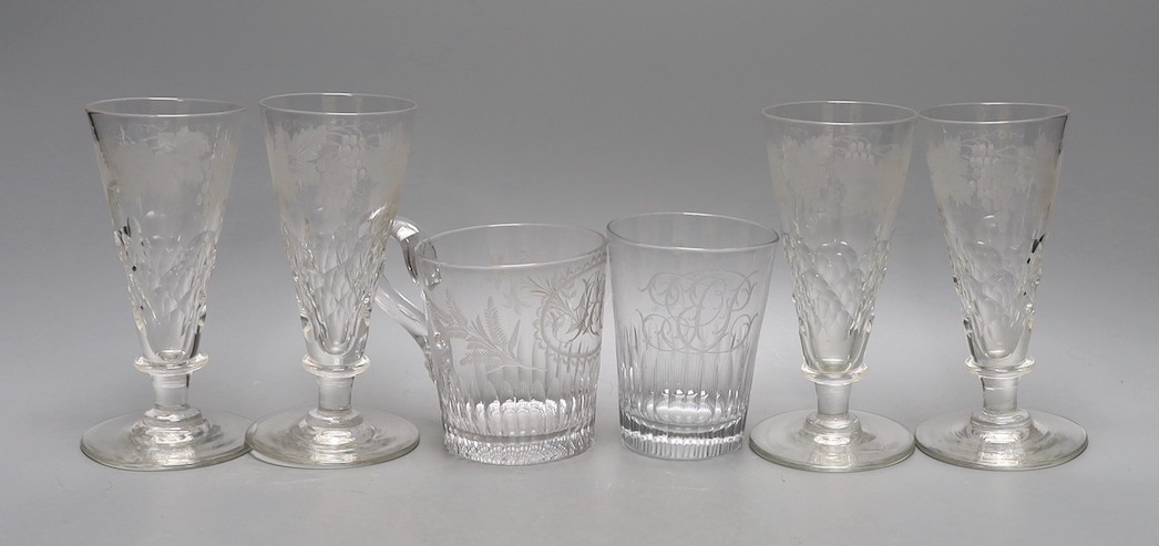 A set of four etched glass flutes, a similar tumbler with an aristocratic crest and mug, and, Flutes 25cms high.